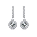 Pair of diamond earrings on a white background