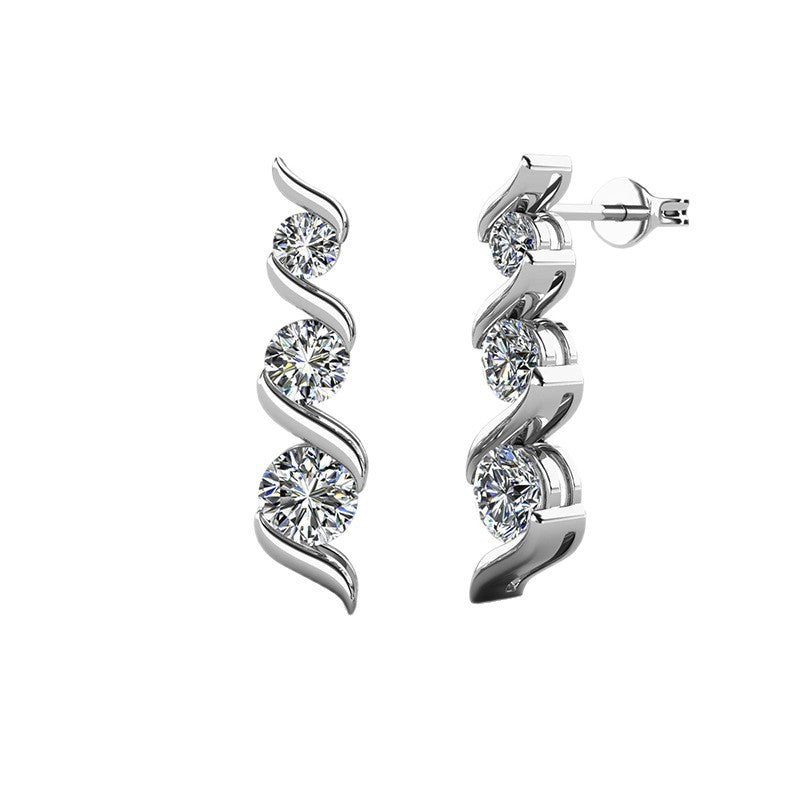 Silver earrings with diamond-like stones on a white background