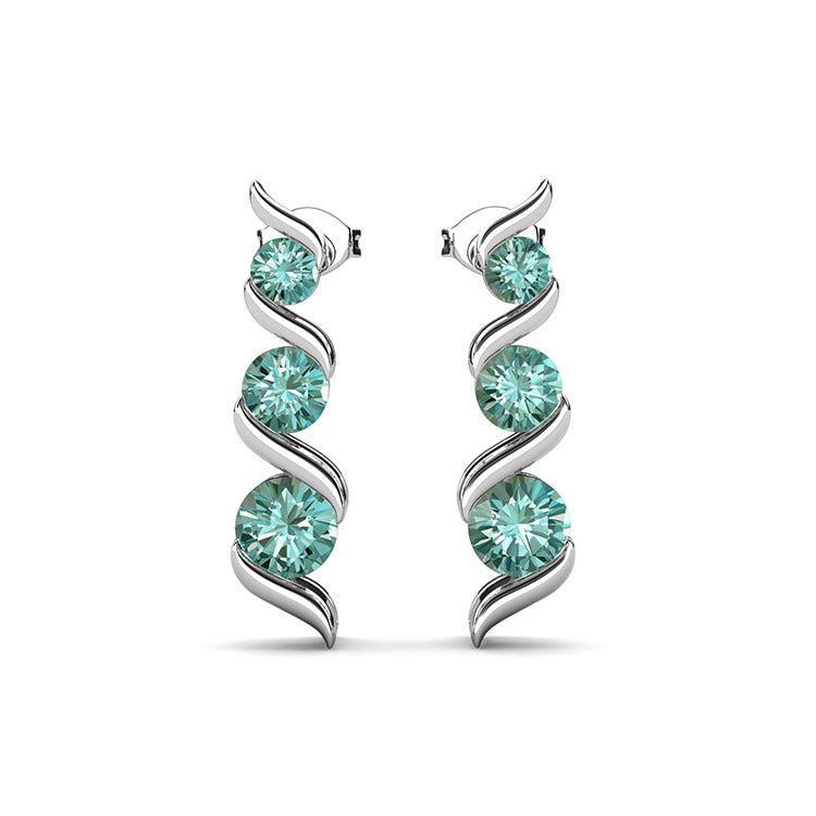 Silver earrings with turquoise gemstones on a white background